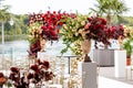 Luxurious arrangement with exquisite florals on your wedding day on the outdoor wedding table. Royalty Free Stock Photo