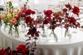 Wedding table in banquet ballroom interior. Beautiful flowers on table in wedding day. Luxury flowers background. Royalty Free Stock Photo