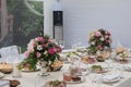 Wedding table in countryside restraunt decorated with pink flowers glasses Royalty Free Stock Photo