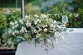 Summer wedding decor for bride and groom table outdoors with candle holders