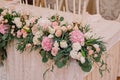 Wedding table decoration with roses, carnations and candles in the tenderly light pink style Royalty Free Stock Photo