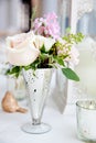 Wedding table decoration series - pink and white bouquet of flowers in a glass vase