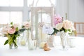 Wedding table decoration series - pink and white bouquet of flowers in vases Royalty Free Stock Photo