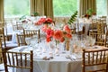 Wedding table decoration series - tables set for beautiful indoor catered luxury wedding event with flower arrangements Royalty Free Stock Photo