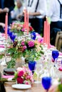 Wedding table decoration series - tables set for beautiful indoor catered luxury wedding event with purple and flower arrangements Royalty Free Stock Photo