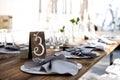 Wedding table decoration. Wedding tablets on the table. Table number three. Wedding textiles on the table Royalty Free Stock Photo