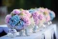 Wedding table decorations in pink and blue. Floral design, special event table set up, wedding outdoor celebration party, banquet Royalty Free Stock Photo