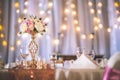 Wedding table with exclusive floral arrangement prepared for reception, wedding or event centerpiece in rose gold color Royalty Free Stock Photo