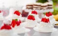 Wedding Table with Mini Cakes with Strawberry on the Top. Royalty Free Stock Photo