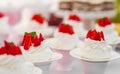 Wedding Table with Mini Cakes with Strawberry on the Top. Royalty Free Stock Photo