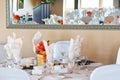 Wedding table place setting reflecting in mirror