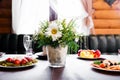 Wedding table in restaurant with flower composition Royalty Free Stock Photo