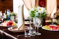 Wedding table in restaurant with flower composition Royalty Free Stock Photo