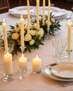 wedding table set for dining, white candles and flowers decorations on a wedding, wedding celebrations concept Royalty Free Stock Photo