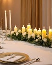 wedding table set for dining, white candles and flowers decorations on a wedding, wedding celebrations concept Royalty Free Stock Photo