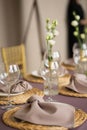 wedding table set with transparent glasses, plates