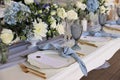 Wedding table set up in pastel blue, gold and white Royalty Free Stock Photo