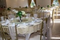 Wedding table sets in wedding hall. wedding decorate preparation. table set and another catered event dinner, Royalty Free Stock Photo