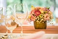 Wedding table setting. Beautiful table set with flowers and glass cups for some festive event, party or wedding reception Royalty Free Stock Photo