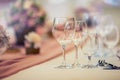 Wedding table setting. Beautiful table set with flowers and glass cups for some festive event, party or wedding reception Royalty Free Stock Photo