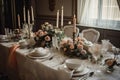 Wedding table setting with flowers, candles, and cutlery, A beautifully decorated dining table with wedding decor and centerpieces Royalty Free Stock Photo