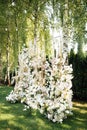 Wedding table setting for newlyweds. Festive table decorated with white plates and napkins. Royalty Free Stock Photo