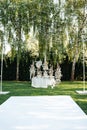 Wedding table setting for newlyweds. Festive table decorated with white plates and napkins. Royalty Free Stock Photo