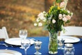 Wedding table setting with pink rose bouquet Royalty Free Stock Photo