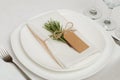 Wedding Table Setting with Rosemary on White Napkin. Wedding Decoration on Provence Style. Romantic dinner. Royalty Free Stock Photo