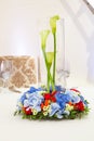 table with an unusual bouquet and floral wreath