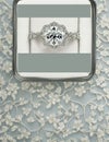 Wedding Theme, Engagement invitation or announcement card with diamond ring in box on white floral on blue-grey background design Royalty Free Stock Photo