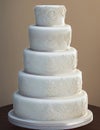 Wedding Theme, Finely detailed multi-tiered intricate completely white only wedding cake, detailed shapes decoration