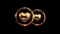 Computer 3d animation of gold wedding rings on a black background. Wedding theme.