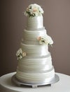 Wedding Theme, Modern style multi-tiered wedding cake intricate motif with white and soft peach color rose decoration Royalty Free Stock Photo