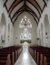 Wedding Theme, Wide angle picture of empty church with arched ceiling with wooden beams, stained glass windows