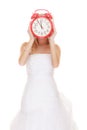 Wedding. Time to get married. Bride with alarm clock. Royalty Free Stock Photo