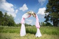 Wedding tradition arch with flower decor on blue sky background