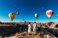 Wedding travel. Honeymoon trip. Couple in love among balloons. A guy proposes to a girl. Couple in love in Cappadocia. Couple in