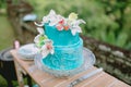 Wedding turquoise cake with flowers and gifts. Wedding banquet