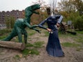 The wedding of two metallic animal-sculptures in a free urban garden