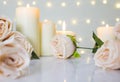 Wedding and Valentine day background with beige roses and candles against bokeh light, sweet and clean concept Royalty Free Stock Photo