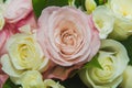 Wedding, Valentine`s day. Beautiful delicate wedding bouquet white and pink roses, wedding rings of the bride and groom Royalty Free Stock Photo
