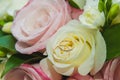 Wedding, Valentine`s day. Beautiful delicate wedding bouquet white and pink roses, wedding rings of the bride and groom Royalty Free Stock Photo