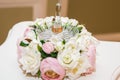 Wedding, Valentine`s day. Beautiful delicate wedding bouquet white and pink roses, wedding rings of the bride and groom Royalty Free Stock Photo