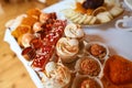 Wedding variety dessert cakes with tasty buffet color decorated with whipped orange and red cream, candy bar, sweet buffet