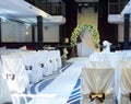 Wedding venue with a bridal bower and chairs Royalty Free Stock Photo