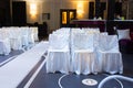 Wedding venue with decorative white chairs Royalty Free Stock Photo