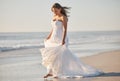 Wedding, waves and a bride walking on beach in Australia on special day in summer. Happy barefoot woman in luxury Royalty Free Stock Photo
