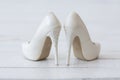 Wedding white shoes with sequins on a white background Royalty Free Stock Photo