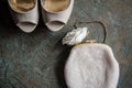 Wedding women's shoes and clutch on brass tray with an ornament